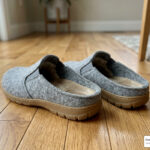 orthopedic slippers for flat feet on hardwood floor