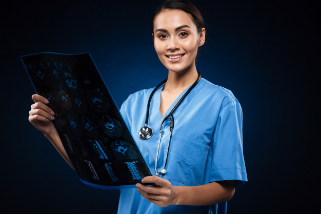 Patient reviewing shoulder MRI scan with orthopedic specialist